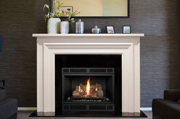A gas fireplace with a clean face set beneath a painted mantel